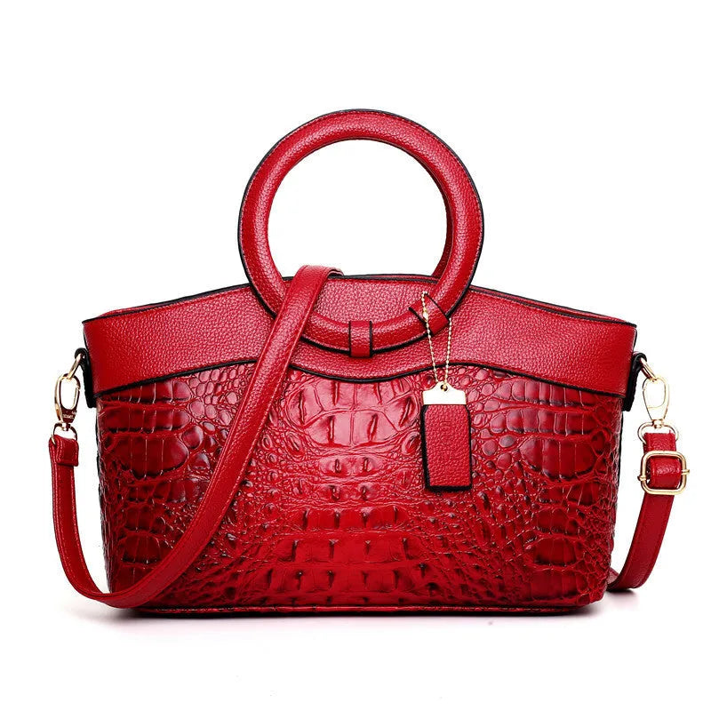Fashion handbag in fabric with shoulder strap, showing internal phone and card compartments