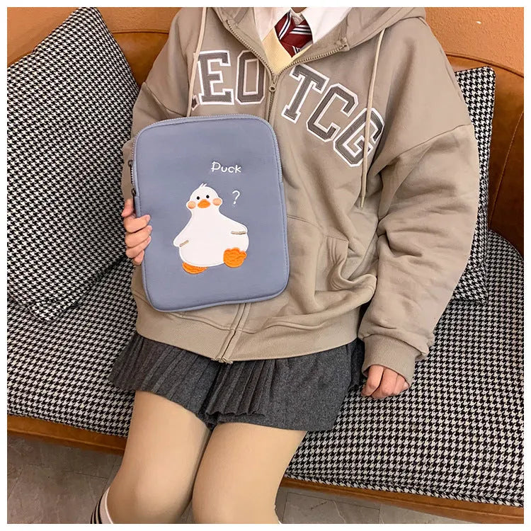 Blue cotton tablet case with embroidered cartoon duck design and zipper closure