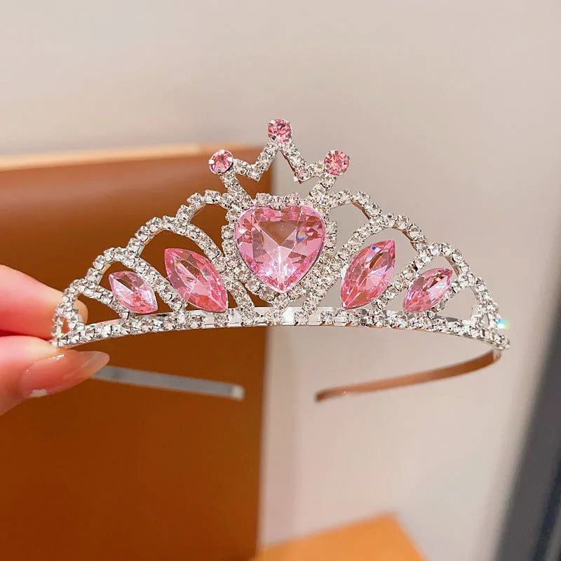 Children's metal alloy crown headdress hairband in pink, light blue, or light purple with crystal decoration.