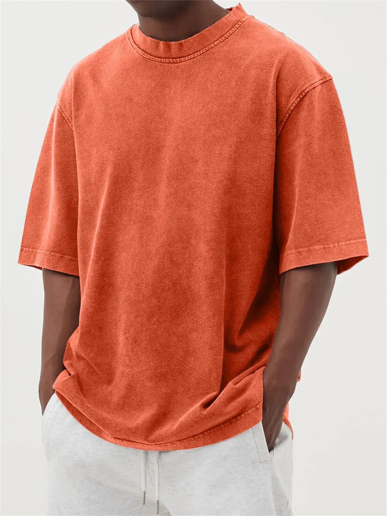 Men's loose fit pullover T-shirt in a stone-washed distressed solid colour, shown in army green.