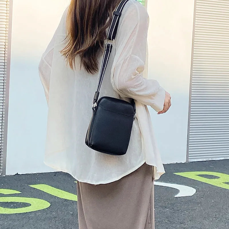 Small solid-colour PU crossbody shoulder bag for mobile phone.