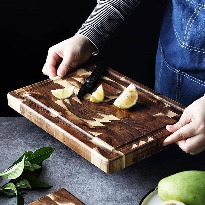 Brown acacia wood parquet cutting board with 3cm thickness on kitchen counter