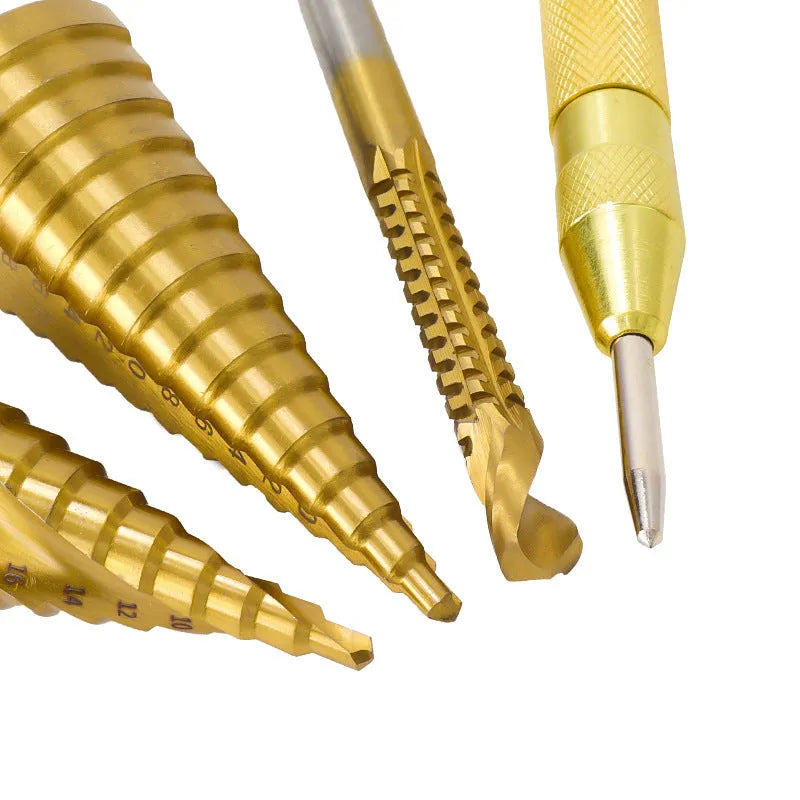 High speed steel cone drill bits and a centre punch arranged in a set, showing colour-coded handles.