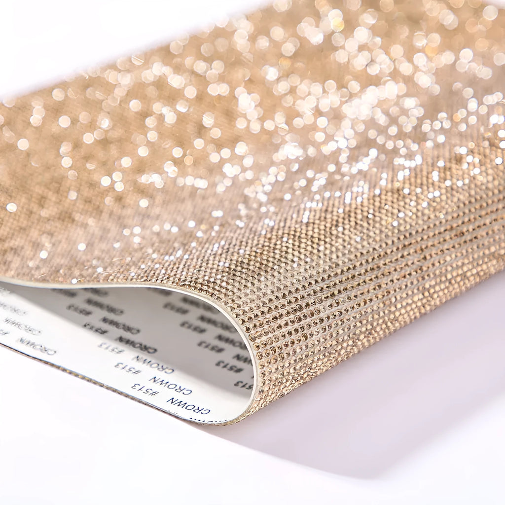Sheet of rhinestone stickers with hot drilling glue net in various colours including red, black, and light green.