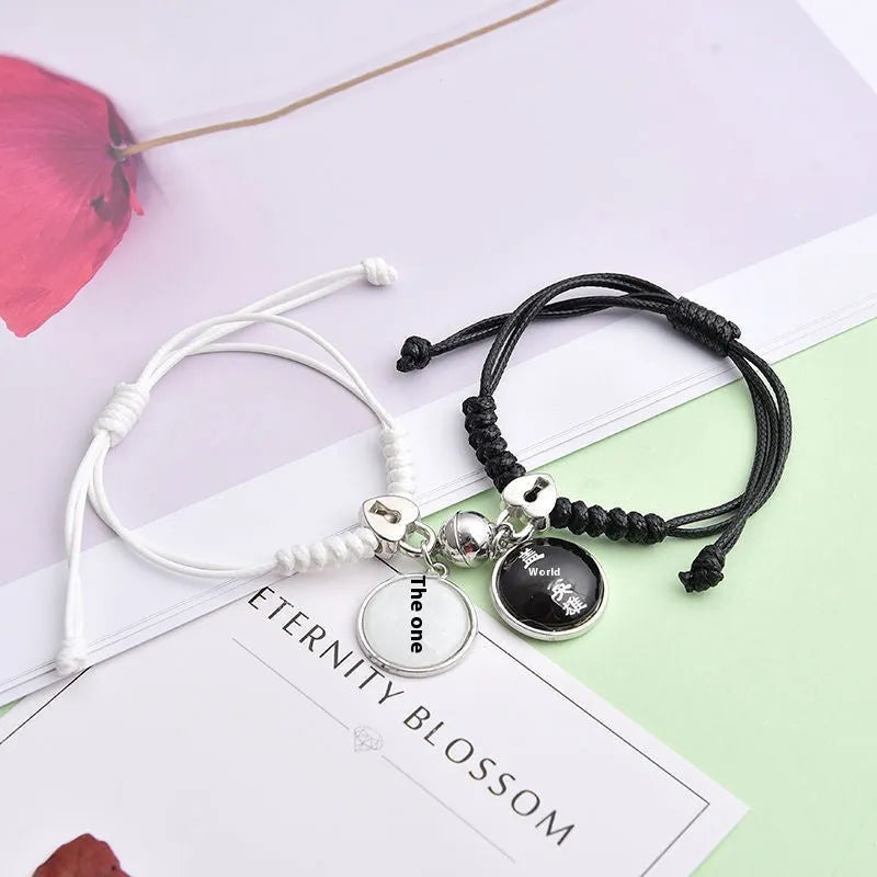 Alloy couple bracelets with magnet closure showing various design options including crown, clover, and text patterns