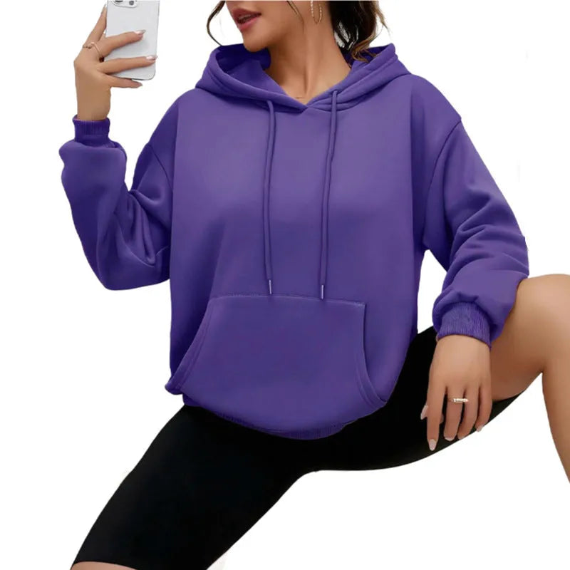 A loose-fitting women's long-sleeve sweatshirt with a drawstring pocket, shown in a solid colour.