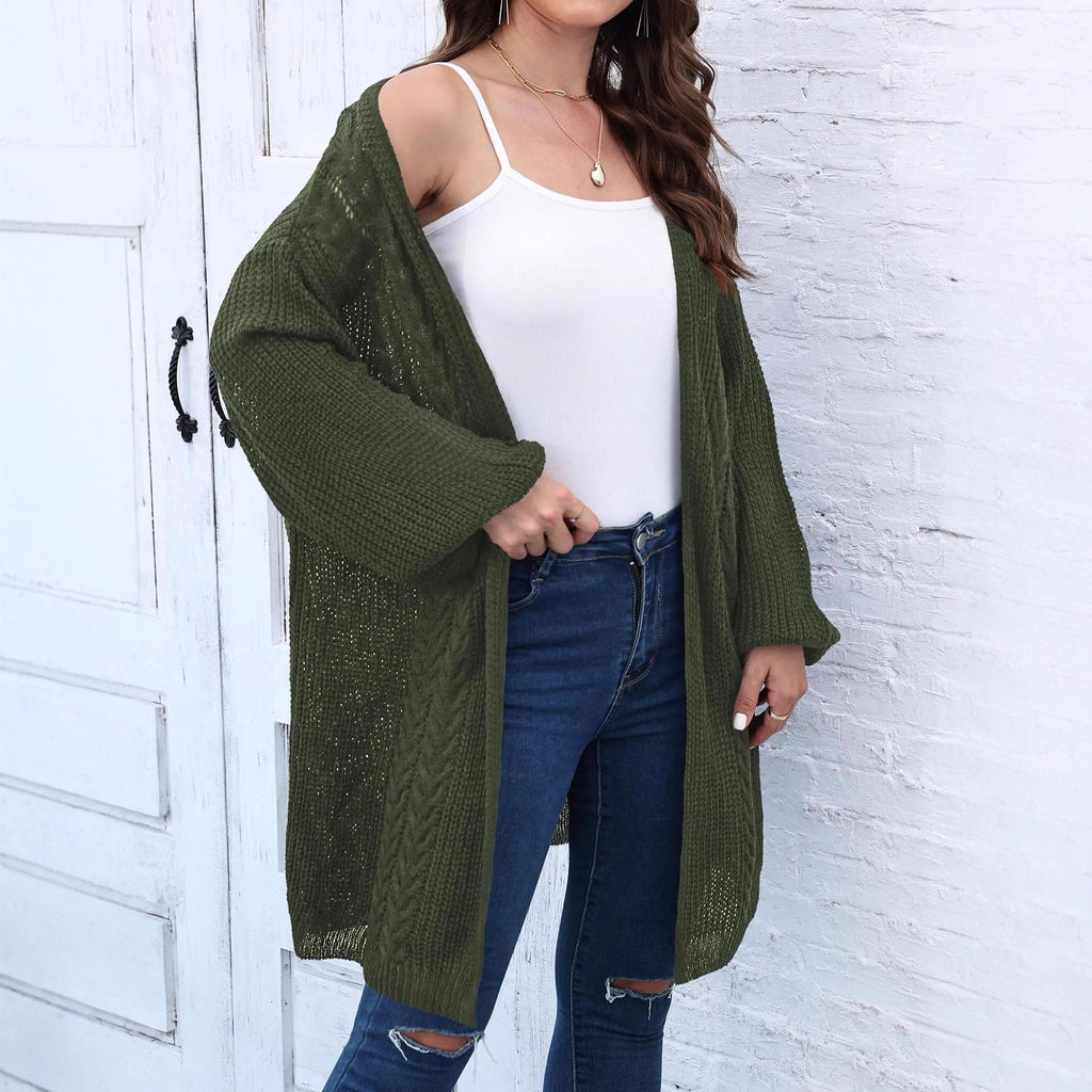 Women's loose brown acrylic sweater coat hanging on a hanger