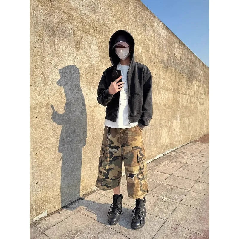 Men's loose camouflage jeans with retro patches and ripped detailing in cropped straight cut