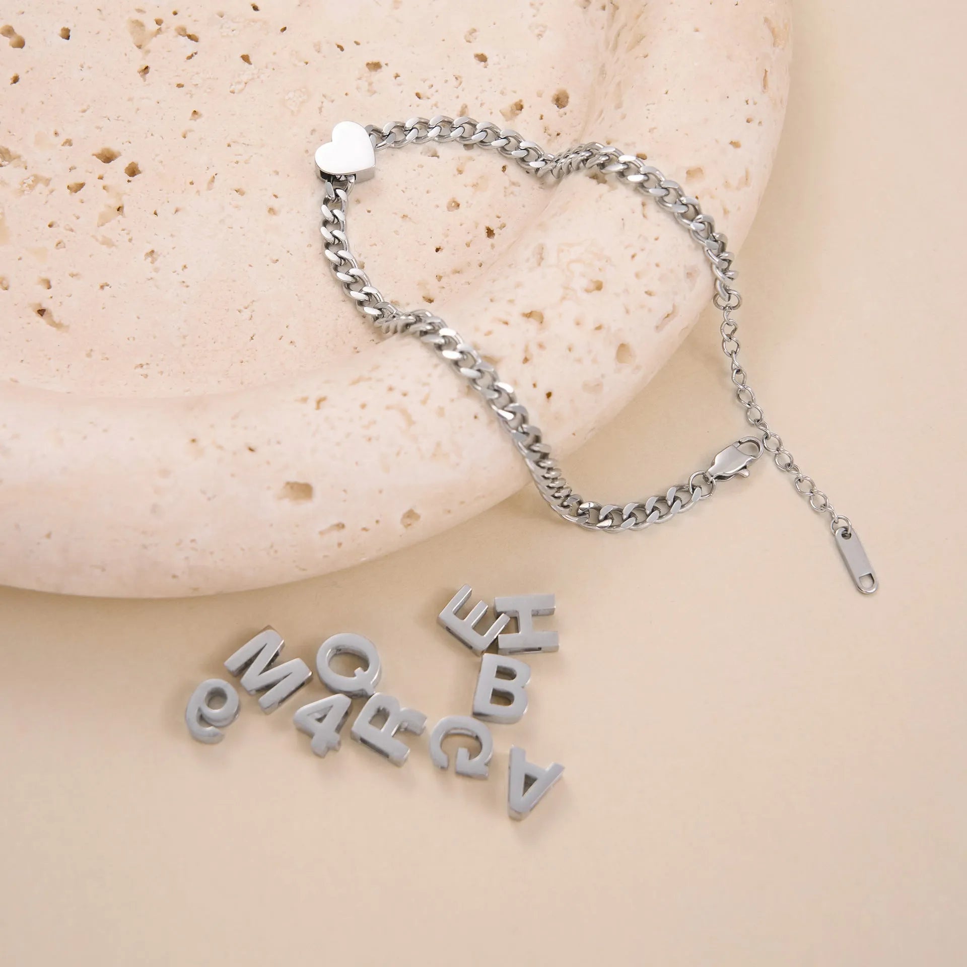 Titanium steel personalised necklace with a charm showing the letter A on a 40.5cm chain.