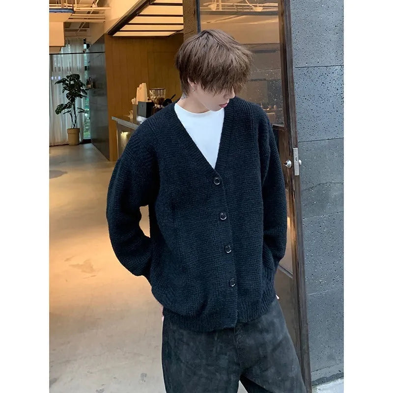 Men's loose-fit V-neck cotton blend cardigan sweater in army green, shown on a hanger.