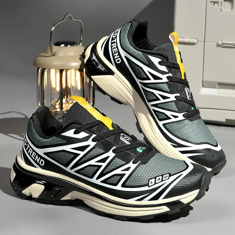 Low-top hiking shoes in khaki with rubber soles and front lace-up closure.