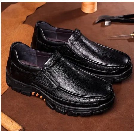 Men's black and brown business casual slip-on shoes made from soft cowhide leather with rubber soles.