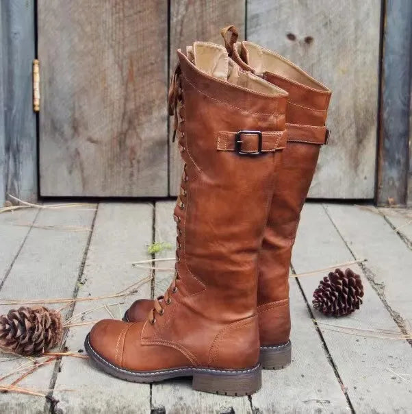 Chunky low heel high leg boots in black, brown, and wine red with rounded toe.