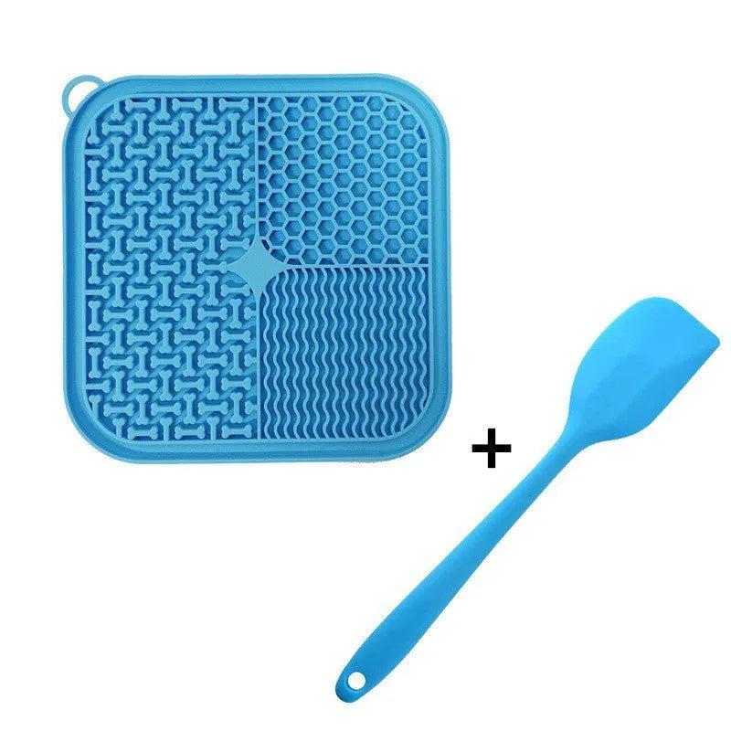 Blue silicone dog licking mat with textured surface and suction cups on back.