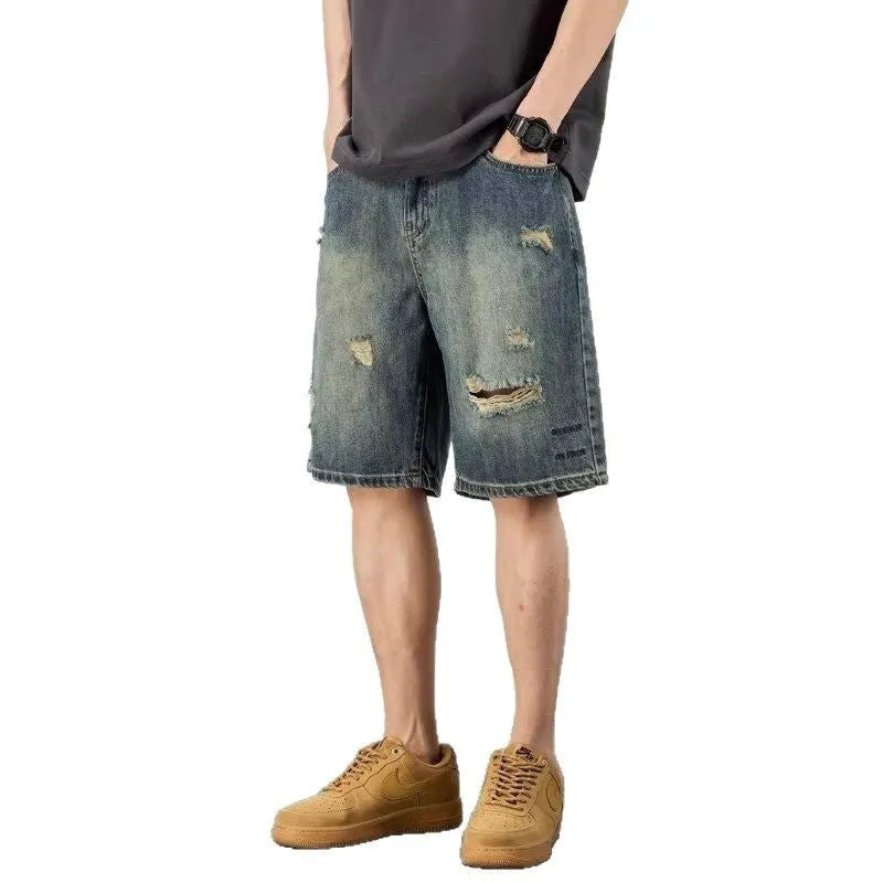Blue retro denim men's shorts with distressed holes and straight leg cut