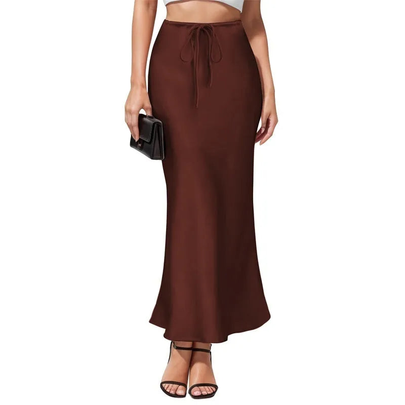 Women's high-waist asymmetric acetate skirt in black showing irregular hem detail
