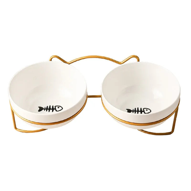 White ceramic pet bowl with cat paw print pattern in black iron frame stand