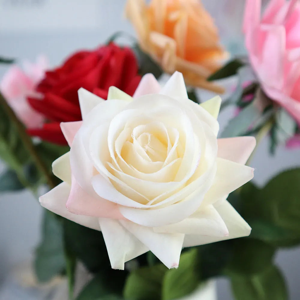 Artificial silk rose bouquet with red fabric flower head and green plastic stem