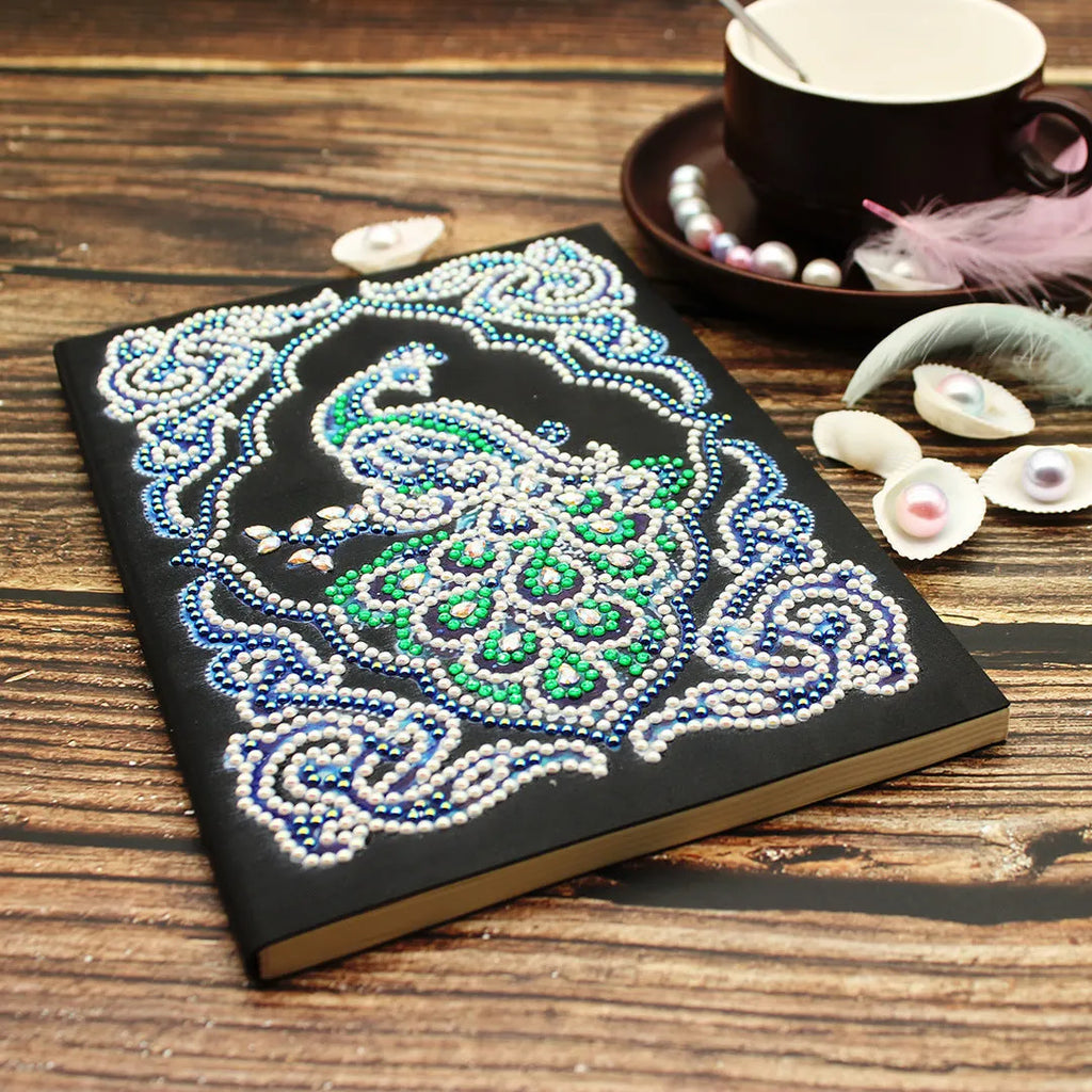 Black A5 diamond painting notebook with peacock design, shaped drills, and OPP packaging
