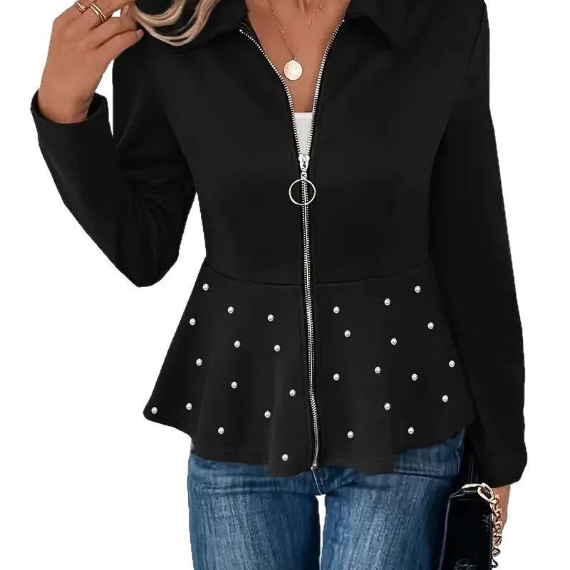 Women's loose black coat with beaded zipper and ruffled hem, shown on a hanger.