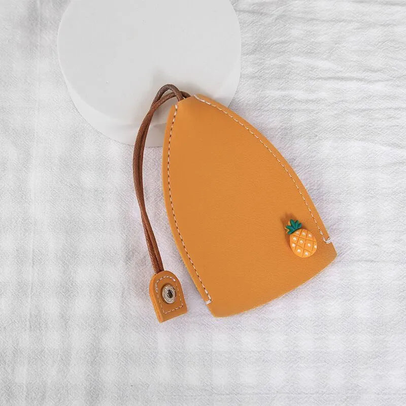 Cartoon pull-out key case in PU leather with colourful design, showing compact 14cm by 7.5cm dimensions