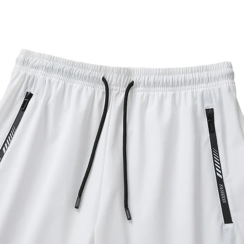Man wearing black loose-fit quick-drying nylon sports shorts for summer.