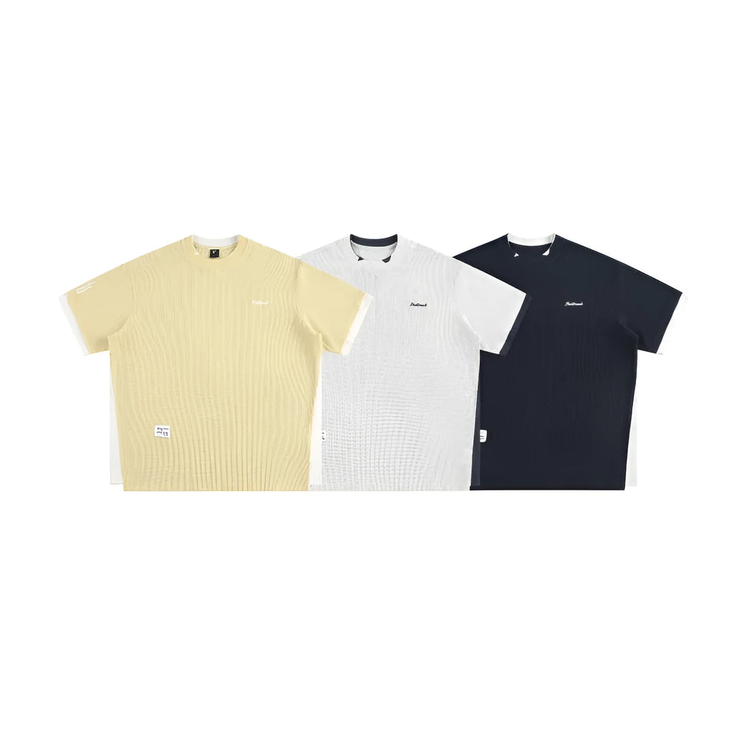 Loose-fit short-sleeved T-shirt with embroidered retro alphabet design on waffle-textured fabric.