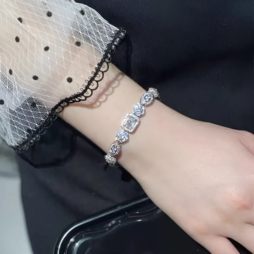 Women's geometric silver-plated bracelet with zircon stones showing adjustable and fixed length options