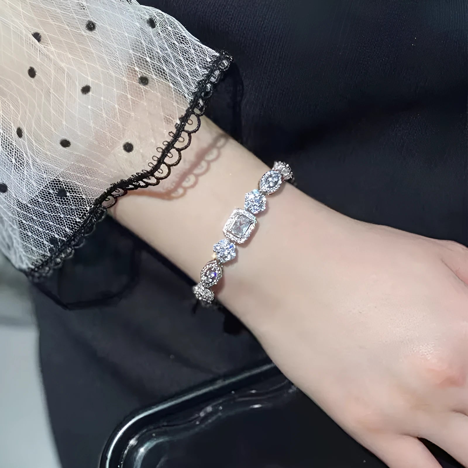 Women's geometric silver-plated bracelet with zircon stones showing adjustable and fixed length options