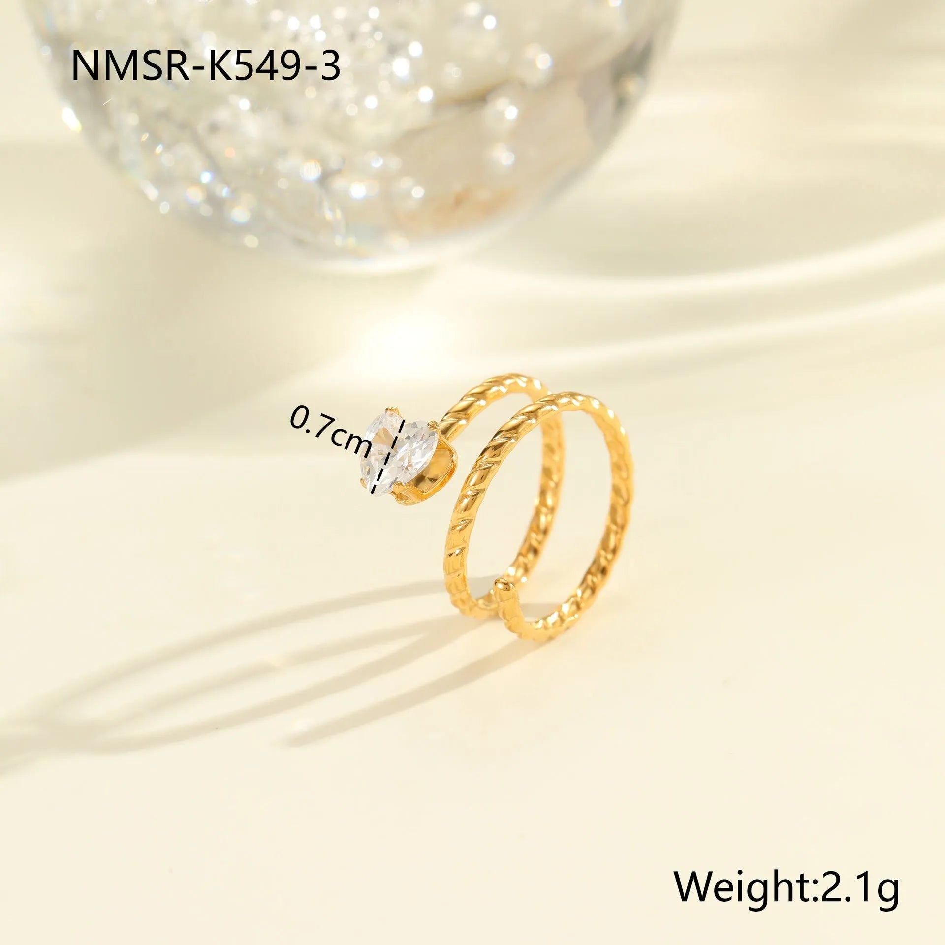 Gold-coloured stainless steel open ring with zircon stones in a geometric heart design.