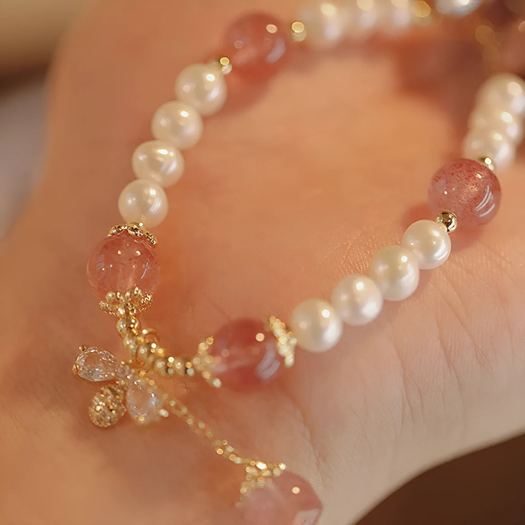 Crystal bracelet with strawberry quartz stringed pearls and bow detail for female summer wear