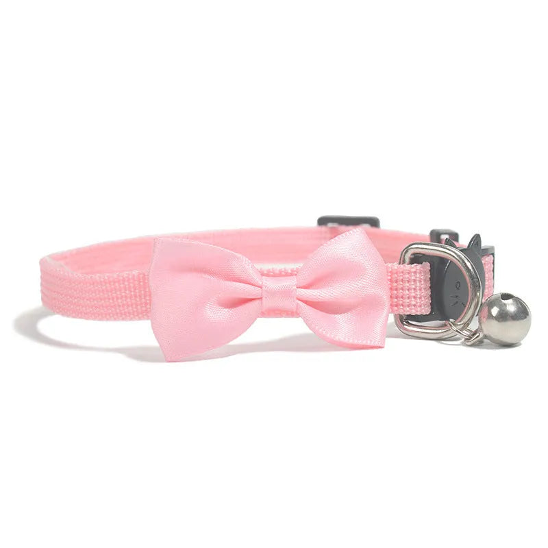 Adjustable nylon cat collar with decorative bow and bell in multiple colour options including red, blue, pink and green