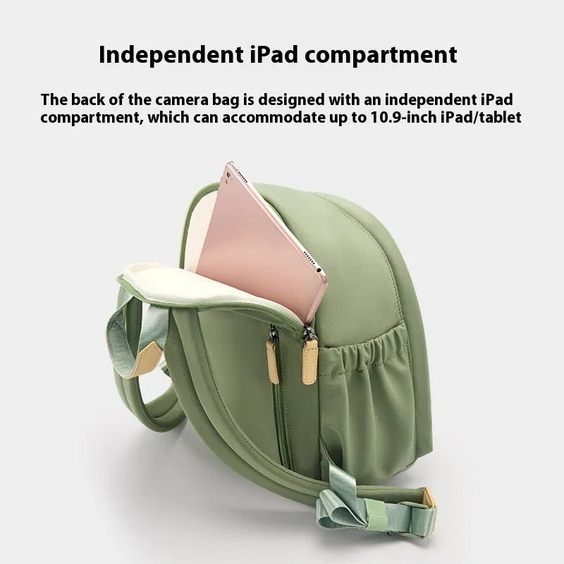 Women's solid-colour shoulder camera bag with a detachable iPad pocket in splash-proof polyester fabric.