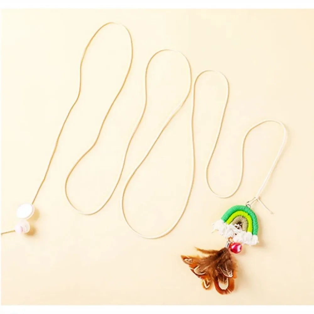 Blue feather cat rope toy hanging from a door with elastic swing and sticky buckle clamp