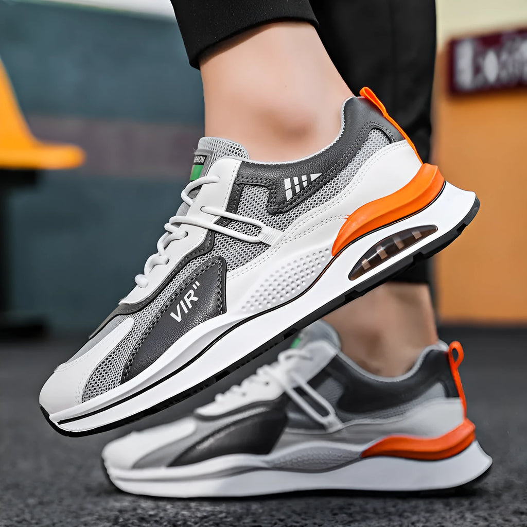Men's gray and black mesh running shoes with a round toe and middle-top design on a white background.