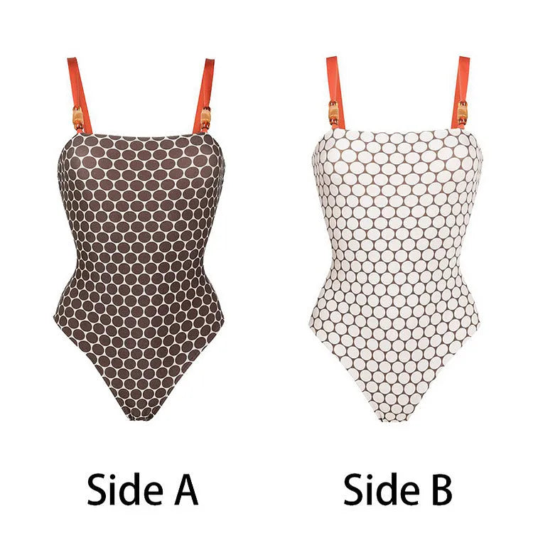 Women's printed dot pattern one-piece swimsuit with matching wrap skirt on a hanger.