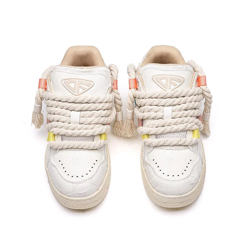 Creamy white retro low-top skateboard shoes with platform heel and lace-up front.