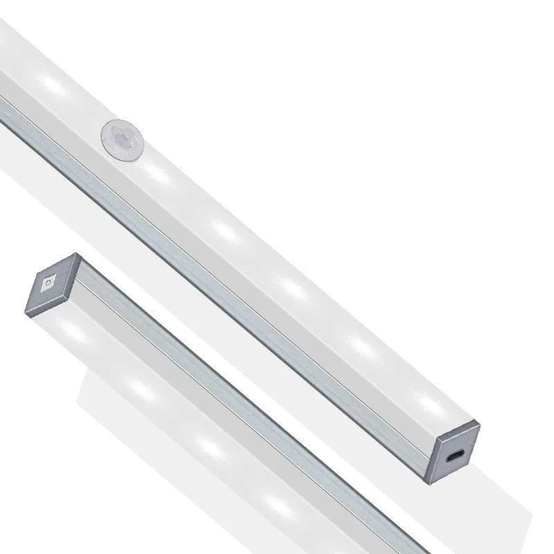 Silver aluminium LED closet light with magnetic back, shown illuminating a wardrobe interior.