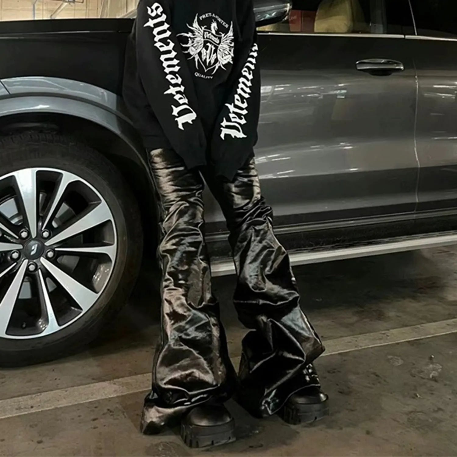Black women's skinny jeans with a shiny patent leather-look coating and straight leg.