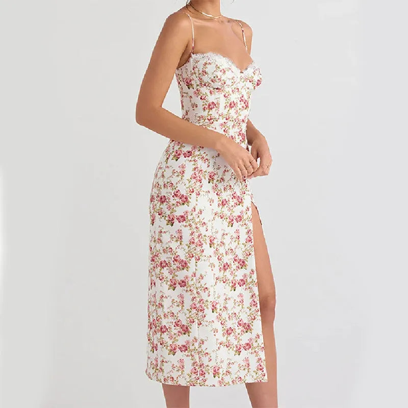 Women's blue lace flower print long dress with suspender neckline and side slit.