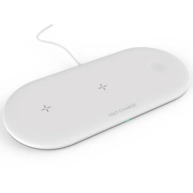 Black three-in-one wireless charging station for iPhone, Apple Watch and headphones on a desk.