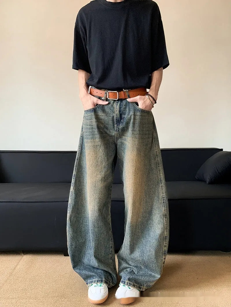 Men's retro blue distressed denim wide-leg jeans with a slimming fit and zip fly