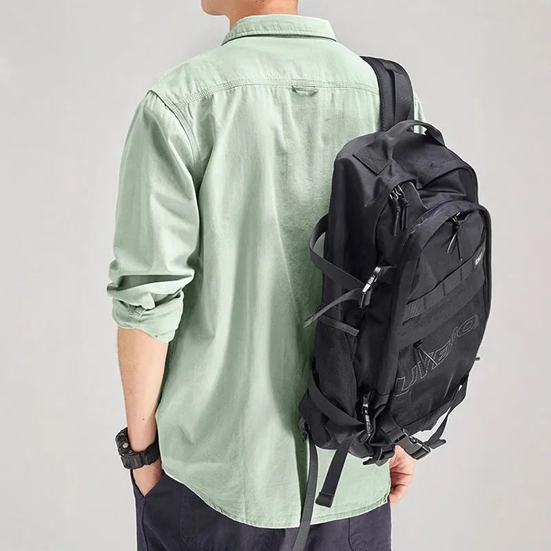 Men's loose long sleeve polyester shirt in cardigan style on a hanger, shown in light grey colour