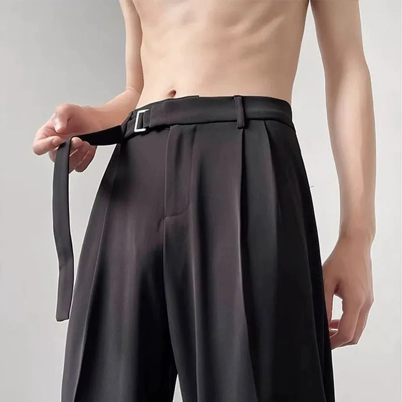 Black straight leg wide trousers on hanger showing loose fit and non-ironing fabric