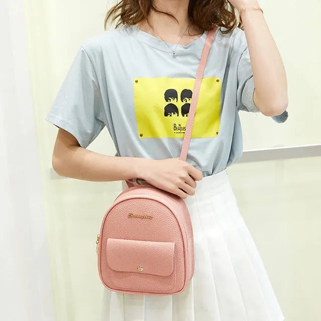 Women's black PU shoulder bag backpack compact letter purse with zipper closure