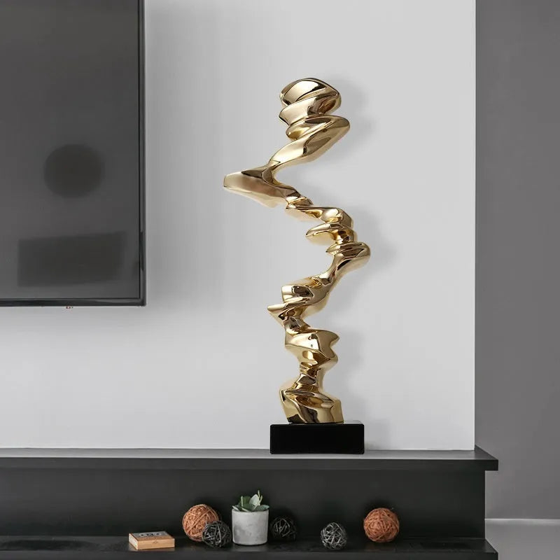 Modern minimalist abstract sculpture in natural resin, available in bright gold, elegant silver, or phantom blue.