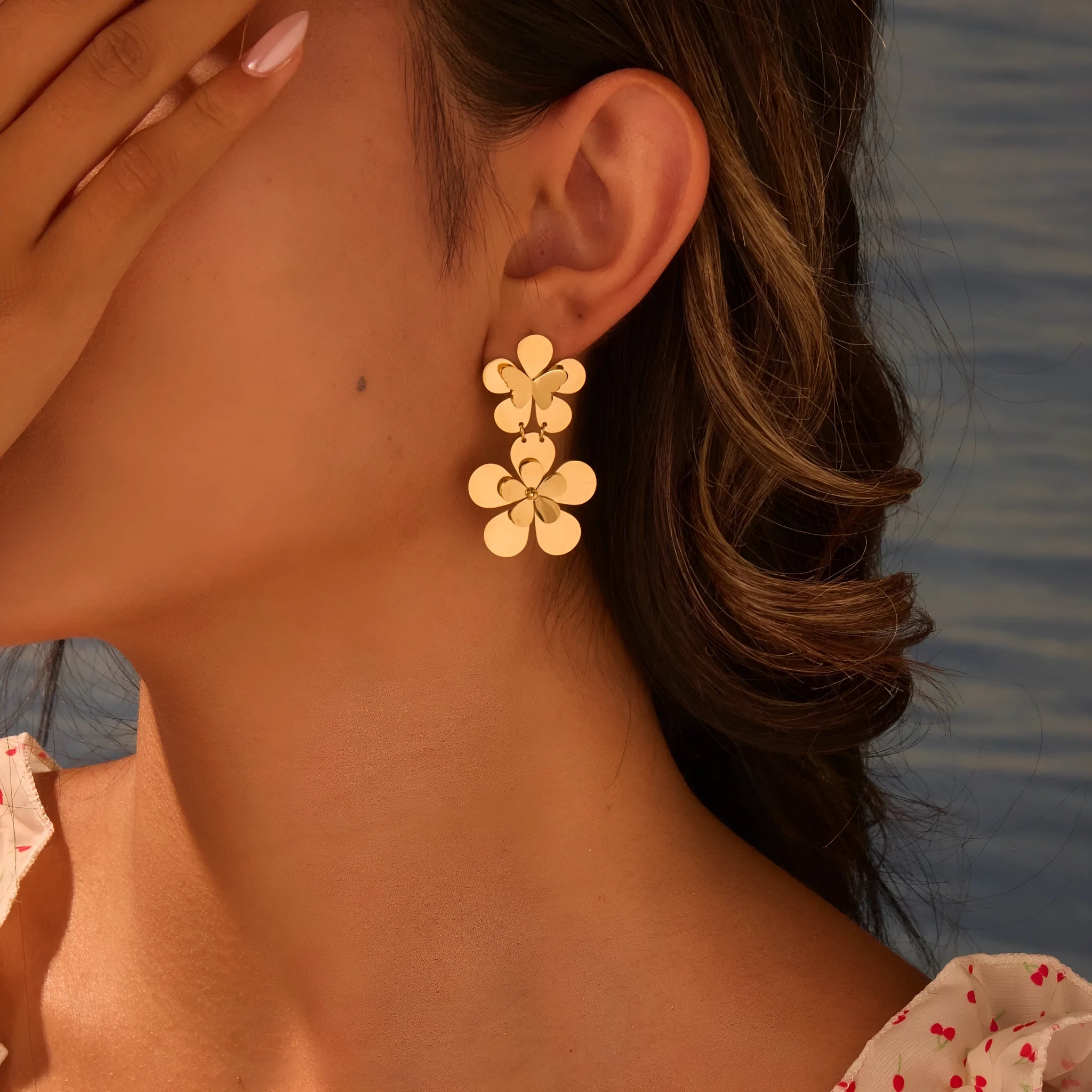 Gold-coloured stainless steel earrings with flower and butterfly design for women
