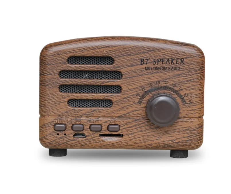 Compact vintage-style wood grain finish Bluetooth speaker on a wooden surface.
