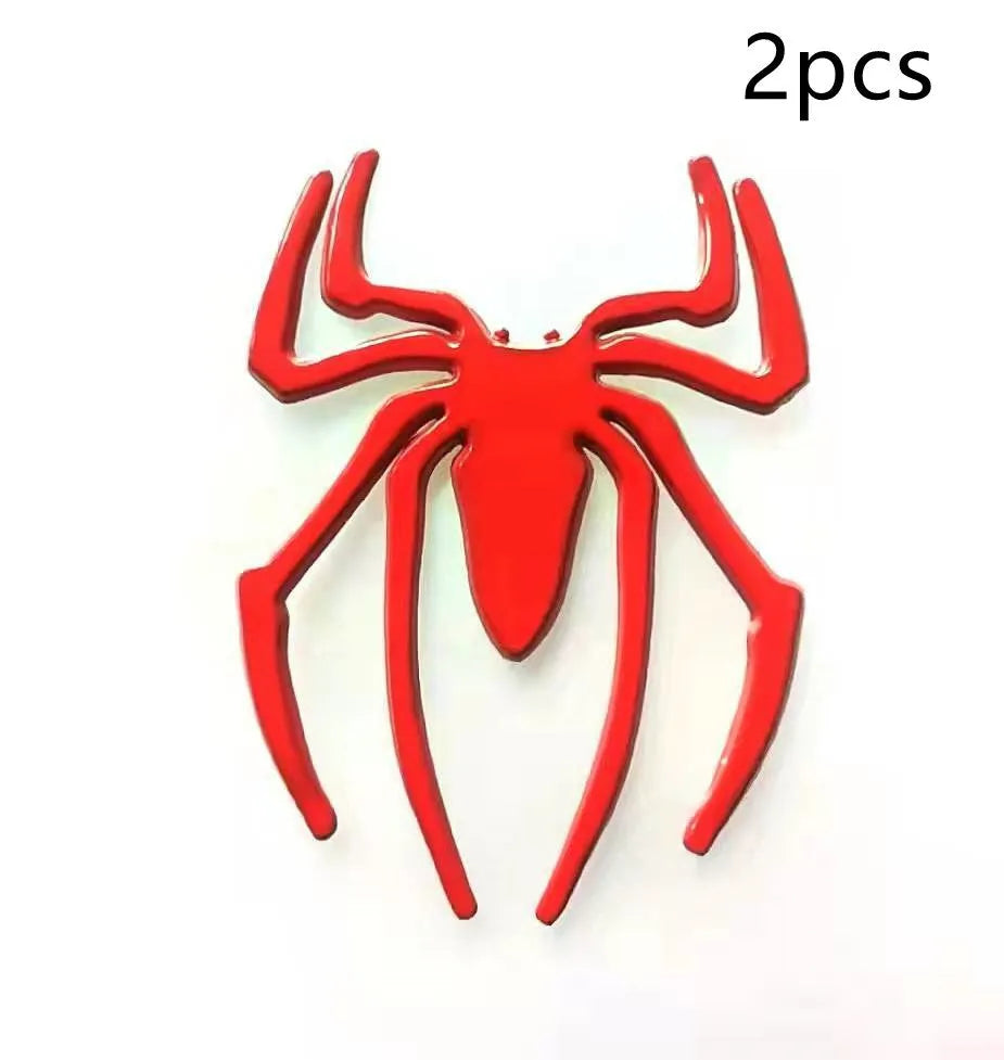 3D metallic spider bumper sticker in gold, silver, black, and red colour options.