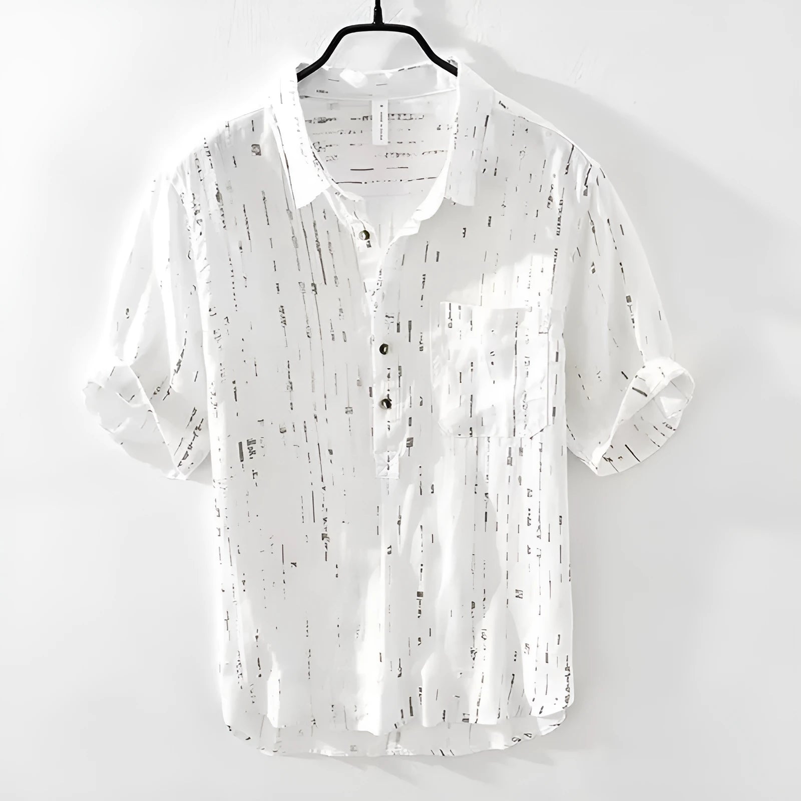 Men's loose fit short sleeve polo shirt in black, showing lapel collar and cardigan style
